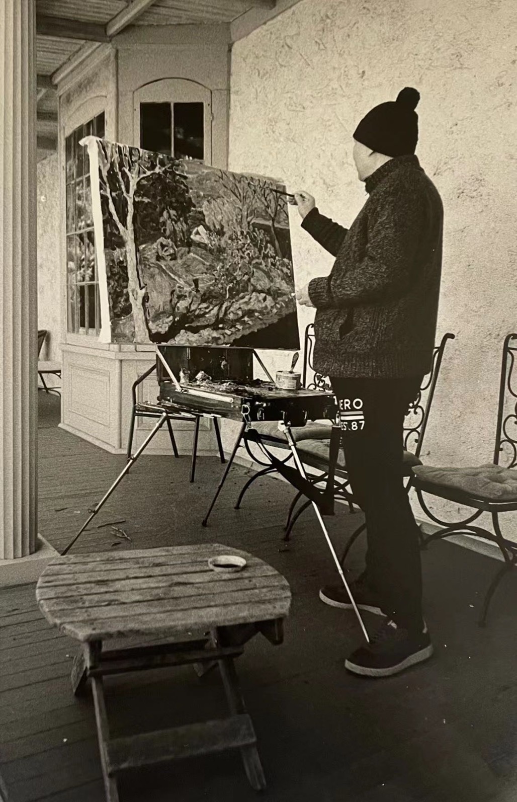 Yang Bin painting at easel